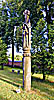 The church in Uzpaliai, wooden sculpture on the church-yard.